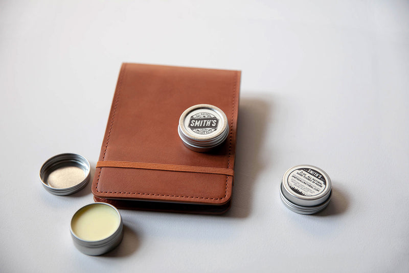 Smith's Leather Balm displayed with leather journal